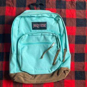 Jansport Backpack with Leather Trimmed Bottom.